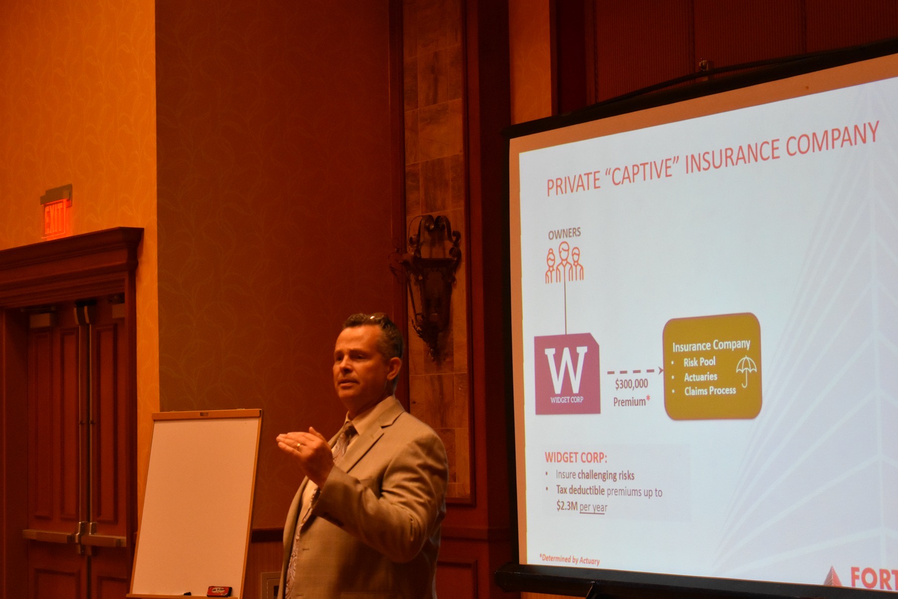 A Fortress principal presenting to a room of financial advisors